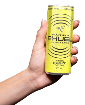 Mānuka Phuel Big Buzz yellow can in hand
